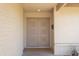 Inviting home entrance featuring double doors, brick accents, and a bright, welcoming feel at 3633 W Redfield Rd, Phoenix, AZ 85053