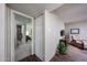 Hallway with tile floors and view of a bedroom with attached bath at 3633 W Redfield Rd, Phoenix, AZ 85053