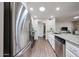 Galley kitchen featuring stainless steel appliances, granite countertops, and ample cabinet space at 3633 W Redfield Rd, Phoenix, AZ 85053