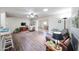 Spacious living room with wood floors, a TV area, and views into the dining room, perfect for entertaining guests at 3633 W Redfield Rd, Phoenix, AZ 85053