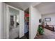 Pantry with stocked shelves in hallway with bedroom and living space views at 3633 W Redfield Rd, Phoenix, AZ 85053