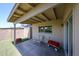 Covered back patio with seating area, storage shed, and view of the backyard at 3633 W Redfield Rd, Phoenix, AZ 85053