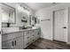 Bright bathroom featuring a double sink vanity with modern fixtures and gray cabinets at 41678 N Salix Dr, San Tan Valley, AZ 85140