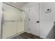 Bathroom featuring a glass shower and a white door with black hardware at 41678 N Salix Dr, San Tan Valley, AZ 85140