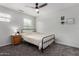 Bright bedroom featuring neutral walls, carpet, a bed, a window, and a fan at 41678 N Salix Dr, San Tan Valley, AZ 85140