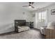 Bedroom featuring neutral walls, carpet, a crib, a chair, a window, and a fan at 41678 N Salix Dr, San Tan Valley, AZ 85140