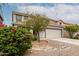Charming front exterior view of a two-story home with a two-car garage and desert landscaping at 41678 N Salix Dr, San Tan Valley, AZ 85140