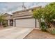 Charming front exterior view of a two-story home with a two-car garage and desert landscaping at 41678 N Salix Dr, San Tan Valley, AZ 85140