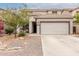 Charming front exterior view of a two-story home with a two-car garage and desert landscaping at 41678 N Salix Dr, San Tan Valley, AZ 85140