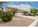 Charming two-story home with a desert-landscaped front yard, long driveway, and neutral color palette at 41678 N Salix Dr, San Tan Valley, AZ 85140