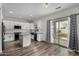 Modern kitchen with island, stainless steel appliances, and sliding door access to backyard at 41678 N Salix Dr, San Tan Valley, AZ 85140