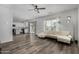 Open-concept living room and kitchen with modern finishes and plenty of natural light at 41678 N Salix Dr, San Tan Valley, AZ 85140
