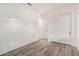 A bedroom with modern flooring, a closet, and neutral wall color at 4571 N Arbor Way, Buckeye, AZ 85396