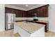 Spacious kitchen featuring stainless steel appliances, granite countertops, and dark cabinetry at 4571 N Arbor Way, Buckeye, AZ 85396
