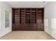 A spacious office with extensive built-in shelving at 4571 N Arbor Way, Buckeye, AZ 85396