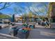 Outdoor patio with comfortable seating arrangements and shade umbrellas, perfect for relaxation at 4571 N Arbor Way, Buckeye, AZ 85396