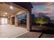 Covered patio with brick trim at 4571 N Arbor Way, Buckeye, AZ 85396