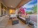 Outdoor living space with comfortable seating on the covered patio at 4571 N Arbor Way, Buckeye, AZ 85396