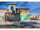 Sunrise Market building featuring decorative murals, signage, and architectural details in a vibrant streetscape at 4571 N Arbor Way, Buckeye, AZ 85396