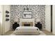 Bedroom with stylish decor, upholstered headboard, and patterned wallpaper at 4642 E Topaz Dr, San Tan Valley, AZ 85143