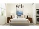 Cozy bedroom with a comfortable bed, modern lighting, and stylish decor at 4642 E Topaz Dr, San Tan Valley, AZ 85143