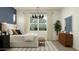 Serene bedroom featuring large windows, neutral tones, and stylish decor elements at 4642 E Topaz Dr, San Tan Valley, AZ 85143