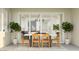 Dining area leading to outdoor space, featuring modern table and plants at 4642 E Topaz Dr, San Tan Valley, AZ 85143