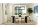 Stylish dining room with modern lighting, neutral decor, and large windows for natural light at 4642 E Topaz Dr, San Tan Valley, AZ 85143