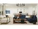 Open-concept living room with modern furnishings, pendant lighting, and seamless flow to the kitchen at 4642 E Topaz Dr, San Tan Valley, AZ 85143
