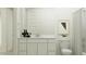 A simple bathroom with modern fixtures, neutral color scheme, and a stylish shower at 4695 E Topaz Dr, San Tan Valley, AZ 85143