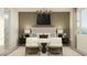 This elegant bedroom features patterned wallpaper, a modern chandelier, and contemporary furnishings at 4695 E Topaz Dr, San Tan Valley, AZ 85143