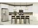 Contemporary kitchen featuring white cabinets, stainless steel appliances, and a center island with seating at 4695 E Topaz Dr, San Tan Valley, AZ 85143