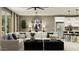 Inviting living room featuring a large sectional sofa and a chandelier above a set of black coffee tables at 4695 E Topaz Dr, San Tan Valley, AZ 85143