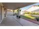 Covered patio with pavers, artificial turf, rock landscape, and block fence at 47 W Calle Monte Vis, Tempe, AZ 85284