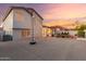 Expansive backyard with a basketball court and an artificial lawn area, complemented by an inviting covered patio at 47 W Calle Monte Vis, Tempe, AZ 85284
