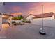 Beautiful backyard featuring a basketball court, an artificial lawn area, and string lighting for evening enjoyment at 47 W Calle Monte Vis, Tempe, AZ 85284
