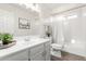 Well-lit bathroom with a vanity, toilet, and shower-tub combination at 47 W Calle Monte Vis, Tempe, AZ 85284