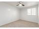 Bright bedroom featuring a ceiling fan and natural light from the window at 47 W Calle Monte Vis, Tempe, AZ 85284