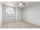Cozy bedroom with a large window and neutral carpeting at 47 W Calle Monte Vis, Tempe, AZ 85284