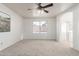 Spacious bedroom with carpet, neutral colors, and large window at 47 W Calle Monte Vis, Tempe, AZ 85284
