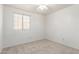 Neutral carpeted bedroom with ceiling fan and window with blinds for natural light at 47 W Calle Monte Vis, Tempe, AZ 85284