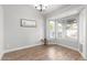 Charming dining room boasts beautiful hardwood floors and a sun-drenched bay window at 47 W Calle Monte Vis, Tempe, AZ 85284