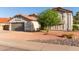 Two story home with a beautiful tree and landscaping, plus a two car garage at 47 W Calle Monte Vis, Tempe, AZ 85284