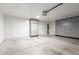 Clean garage with epoxy flooring, ample storage cabinets, and overhead lighting at 47 W Calle Monte Vis, Tempe, AZ 85284