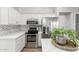 Modern kitchen showcasing stainless steel appliances, chevron backsplash, and sleek countertops at 47 W Calle Monte Vis, Tempe, AZ 85284