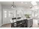 Bright kitchen with an island, sleek countertops, modern lighting and stainless steel appliances at 47 W Calle Monte Vis, Tempe, AZ 85284