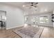 Bright, open living room features hardwood floors, a ceiling fan, and natural light with modern updates at 47 W Calle Monte Vis, Tempe, AZ 85284