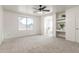 Spacious main bedroom featuring a ceiling fan, natural light, and bathroom access at 47 W Calle Monte Vis, Tempe, AZ 85284