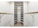 Walk-in closet with built-in shelving and hanging rods for ample storage at 47 W Calle Monte Vis, Tempe, AZ 85284