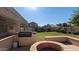 Great backyard with BBQ and a fire pit, perfect for outdoor gathering at 4730 N 111Th Ln, Phoenix, AZ 85037